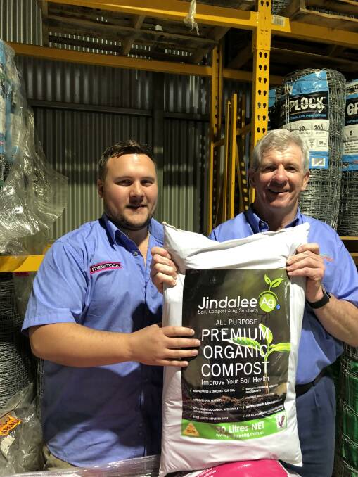 Australian Farm & Fencing owner Russel Durnan and Rory Bonner with a bag of Jindalee Ag Premium organic compost.