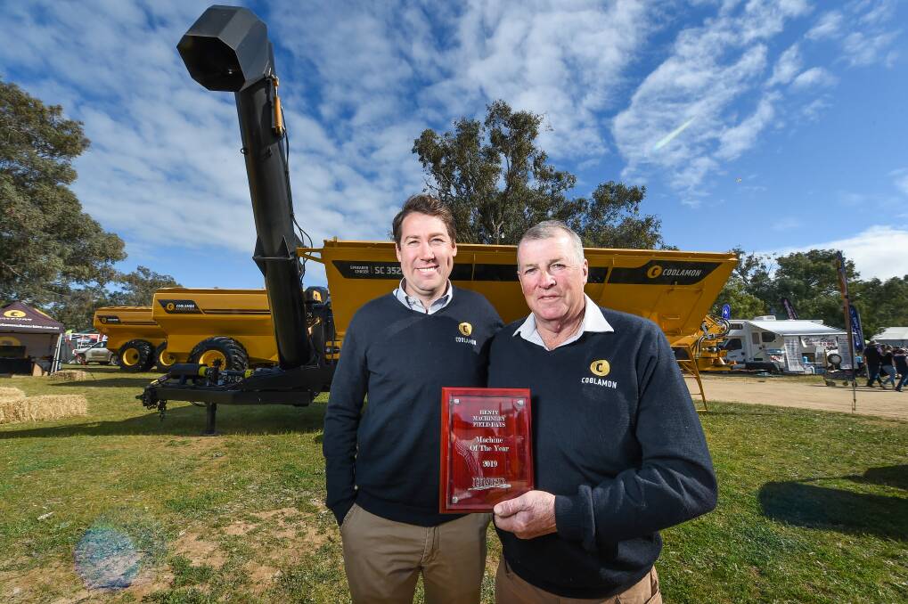 FATHER SON: Heath and Bruce Hutchinson with the 2019 Henty Machine of the Year the Coolamon Spreader Chaser. Picture: MARK JESSER