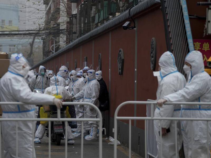 China is expanding lockdowns as its number of COVID-19 cases hits a daily record. (AP PHOTO)