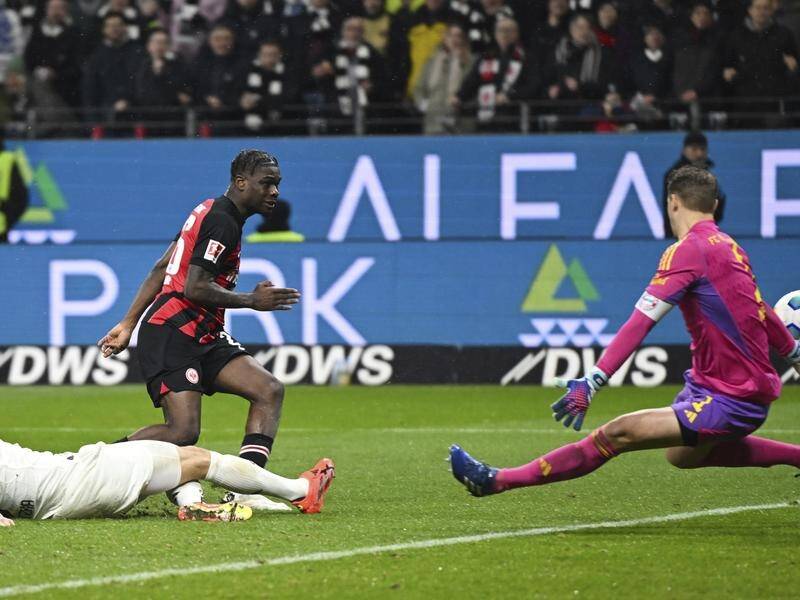 Frankfurt's Eric Dina Ebimbe scores his side's fourth goal past Manuel Neuer. (AP PHOTO)
