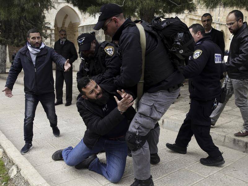 Israeli police say they have arrested 19 Palestinian protesters at a contested Jerusalem holy site.