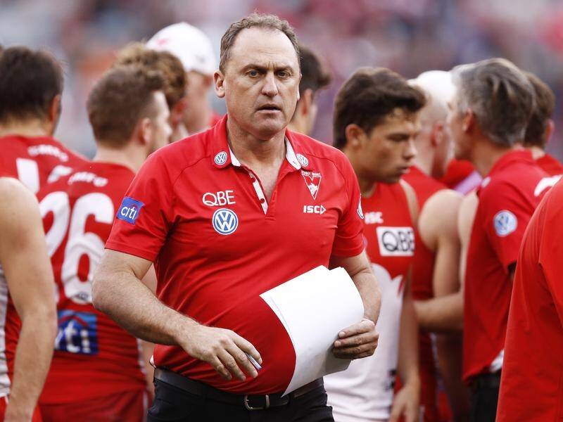 Coach John Longmire hasn't been able to celebrate a new AFL deal, with Sydney losing to Carlton.