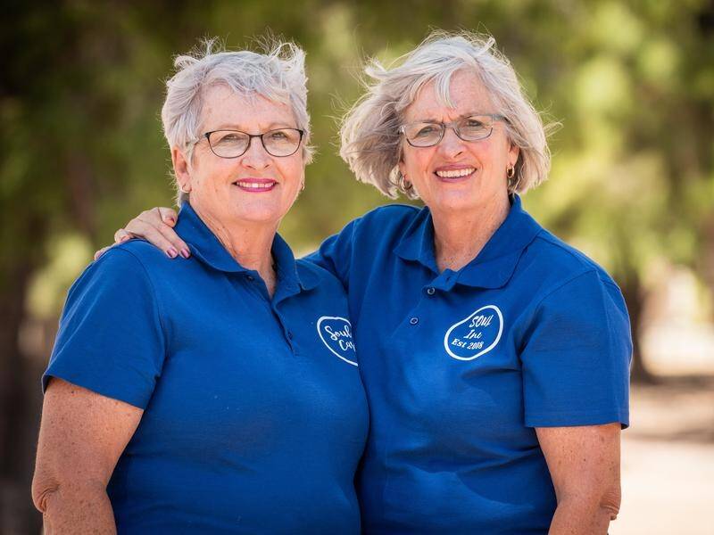 Identical twins Eileen Giles (right) and Patty Powell run homeless charity Servants of United Love.
