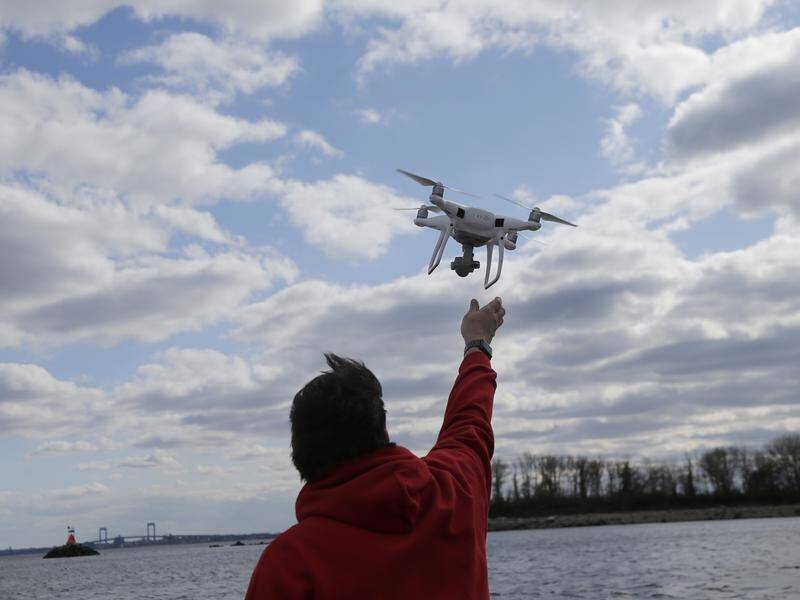 A US science panel says federal regulators are overly conservative on drones.