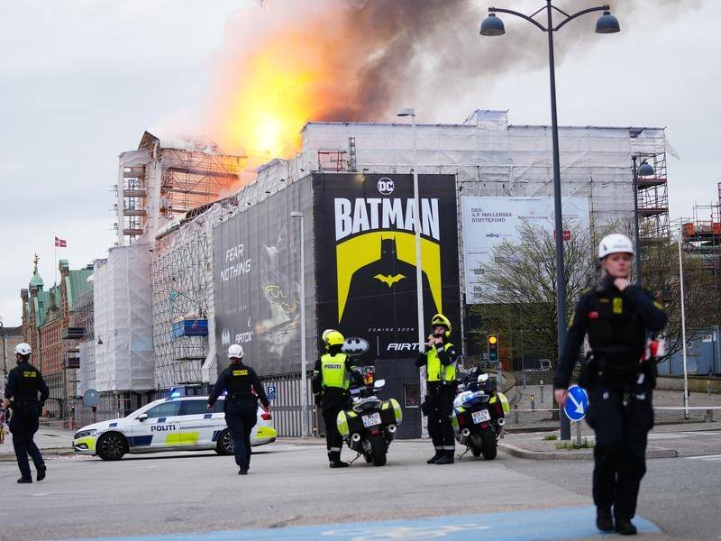 Billows of smoke rose over downtown Copenhagen as fire ripped through the Old Stock Exchange. (AP PHOTO)