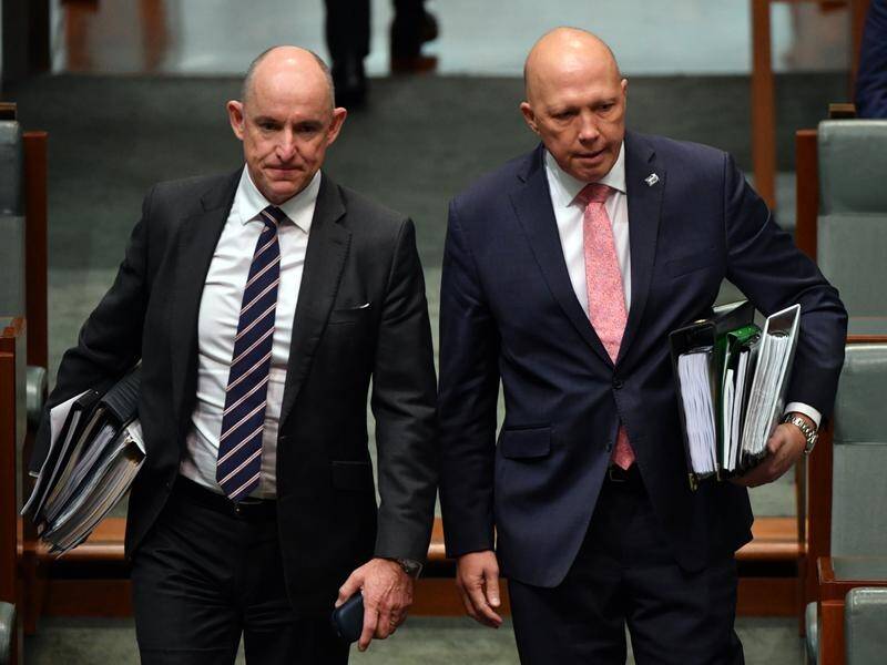 Peter Dutton is the best choice for Liberal leader, former education minister Stuart Robert (l) says