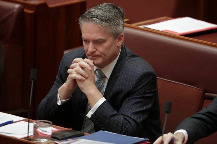 Senator Mathias Cormann listens to Senator Penny Wong after he sought to restore the Same-sex Marriage Plebiscite Bill to the Senate at Parliament House in Canberra on Wednesday 9 August 2017. Fedpol. Photo: Andrew Meares 