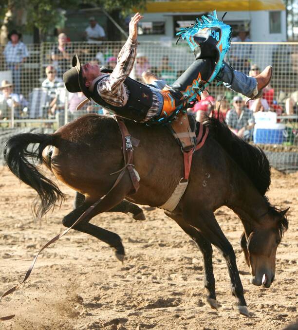 Luke Charles rides in the bareback event at Narrandera Rodeo. Pictures: Les Smith