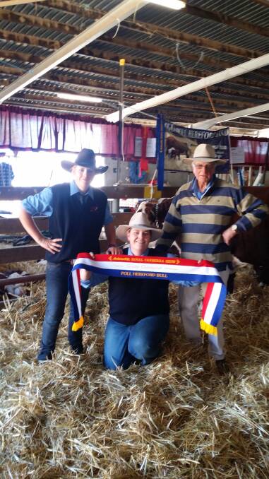Nicole, Kimberley and John Rodd after winning with their senior Poll Hereford bull at the Royal Canberra Show.