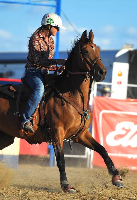 Jess Hindmarsh rides in the barrel race at the 2013 Wagga Rodeo.