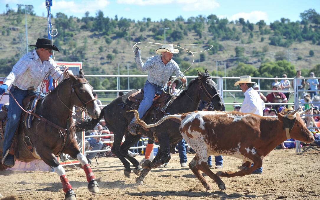 Michael Gaffey and Corey Heath participate in the team roping during the Wagga Rodeo in 2012.