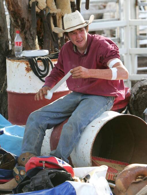 Luke Charles of Blackwater tapes up before his event at the Narrandera Rodeo. Pictures: Les Smith