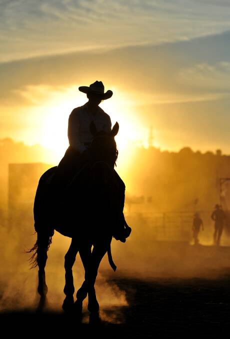 A cowgirl participates in the 2013 Wagga Rodeo.