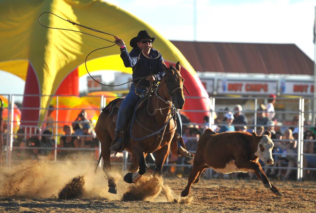 Michael Reynolds, The Rock, participates in the rope-and-tie at the Wagga Rodeo in 2013.